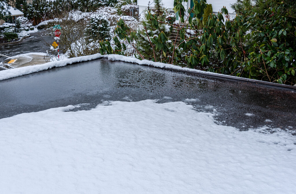 Ice Snow and Water Damage on Commercial Flat Roof